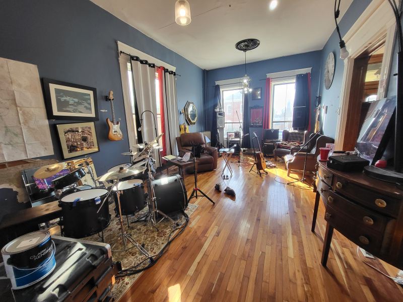 Original listing photo of the Champion House music room with instruments