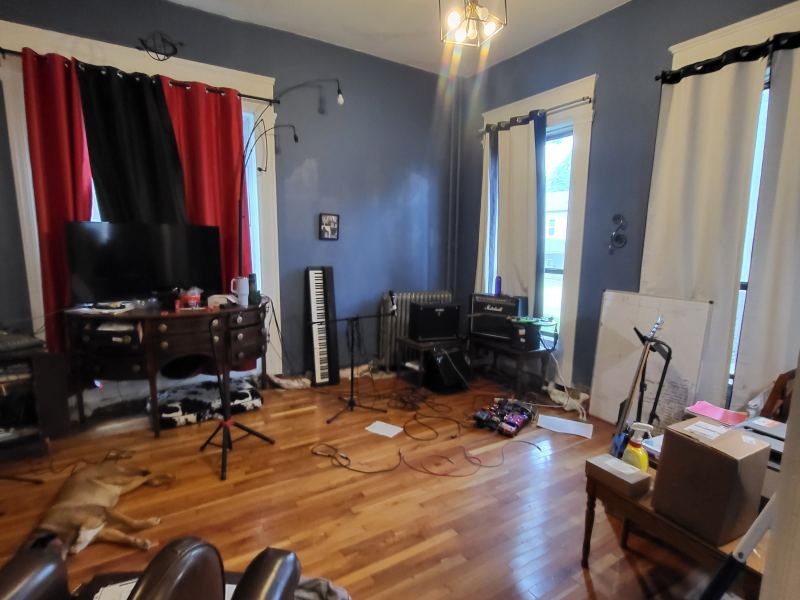 Original listing photo of a Champion House music room from the doorway