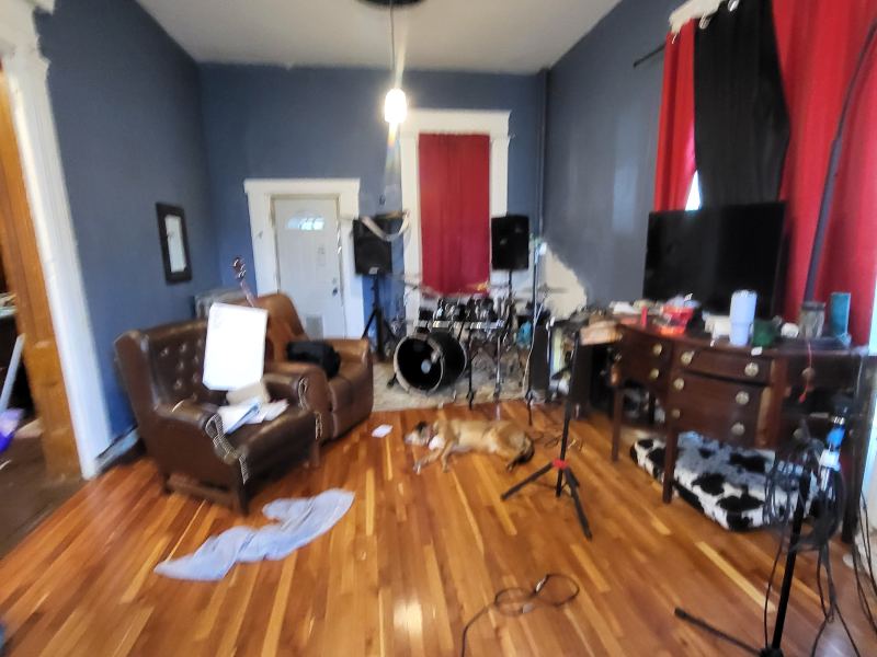 Original listing photo of a Champion House music room with chairs and instruments