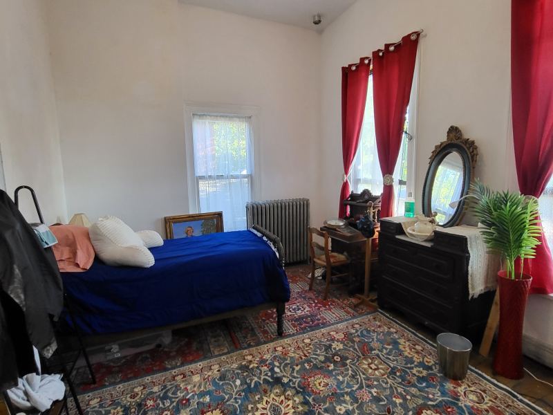 Original listing photo of a Champion House bedroom and closet area
