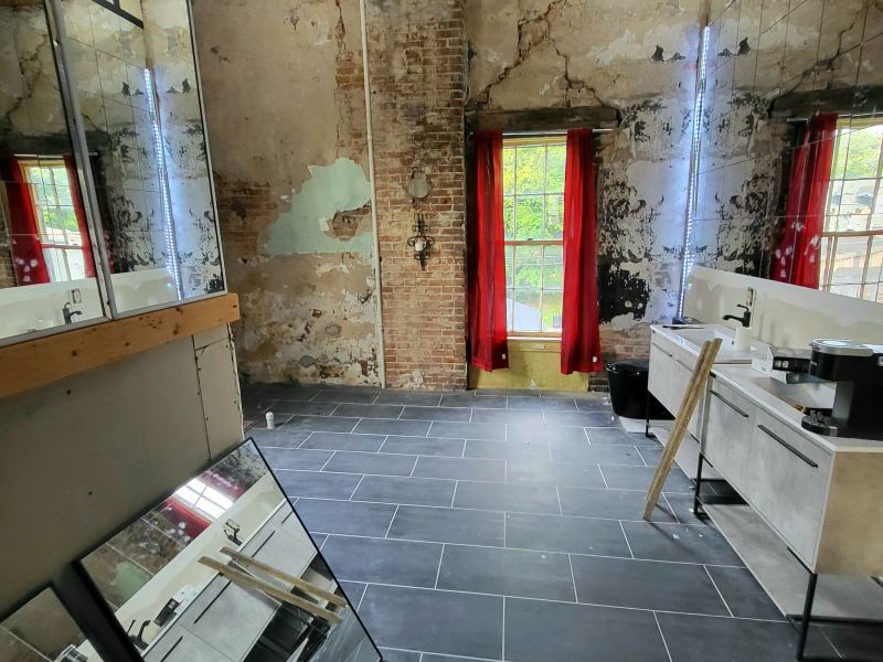 Original listing photo of Champion House bath with mirror and sink area
