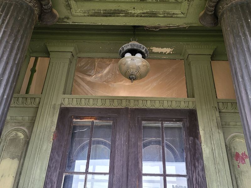 Original listing photo of Champion House porch ceiling and doorway