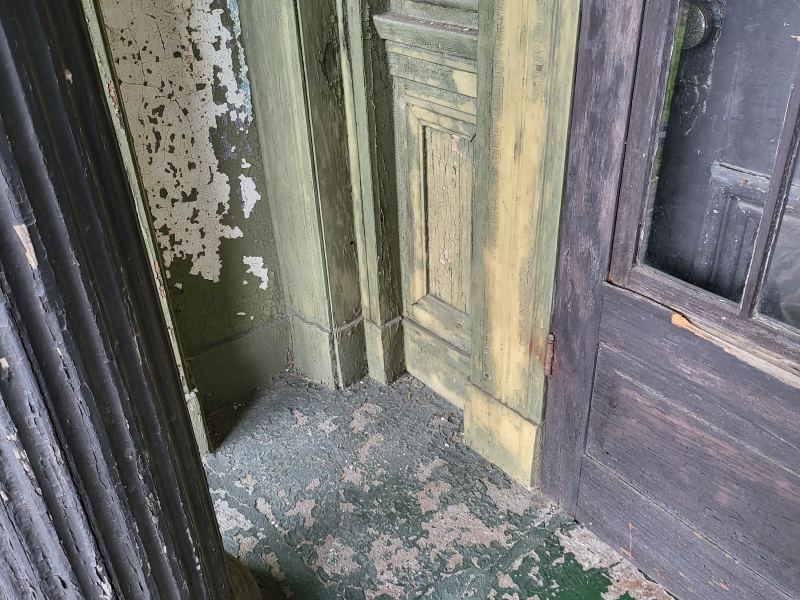 Original listing photo of Champion House front door trim