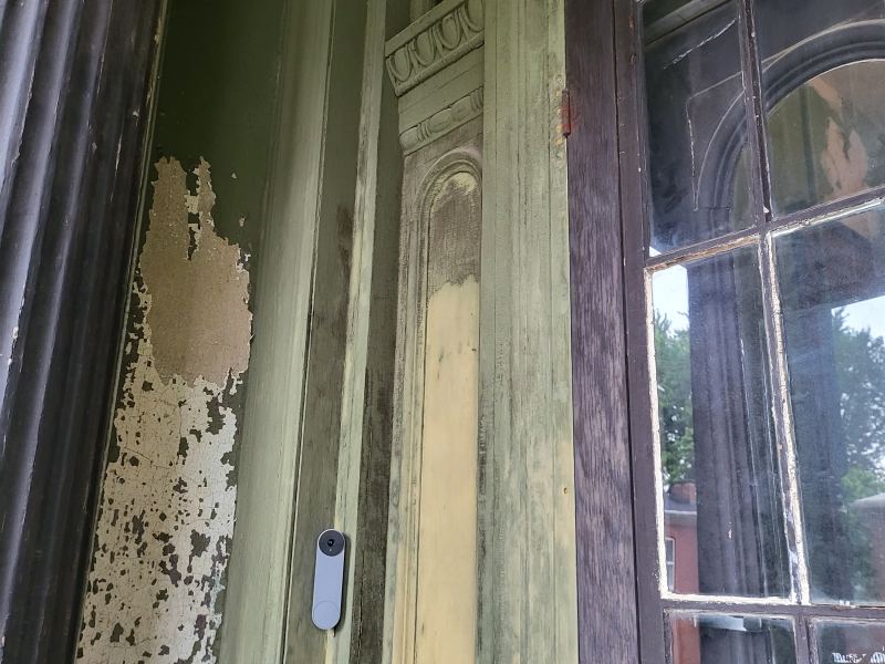 Original listing photo of Champion House entry trim and doorbell