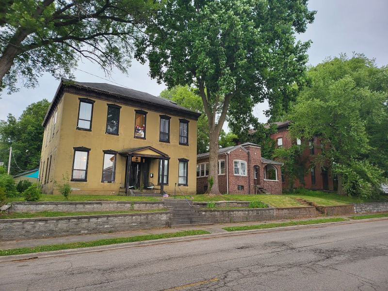 Original listing photo of Champion House exterior from across the street